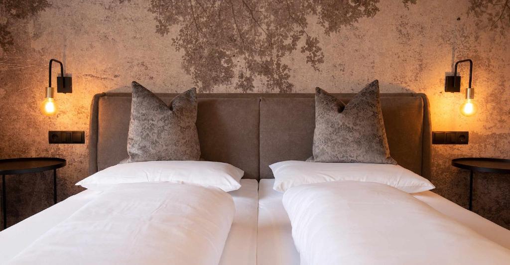 Voodi või voodid majutusasutuse Saldur Small Active Hotel toas