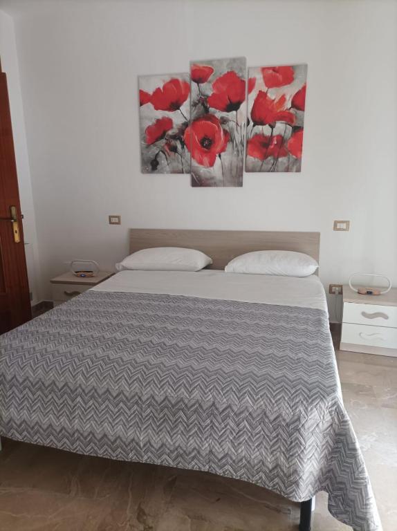Postel nebo postele na pokoji v ubytování A casa di Elena e Francesco