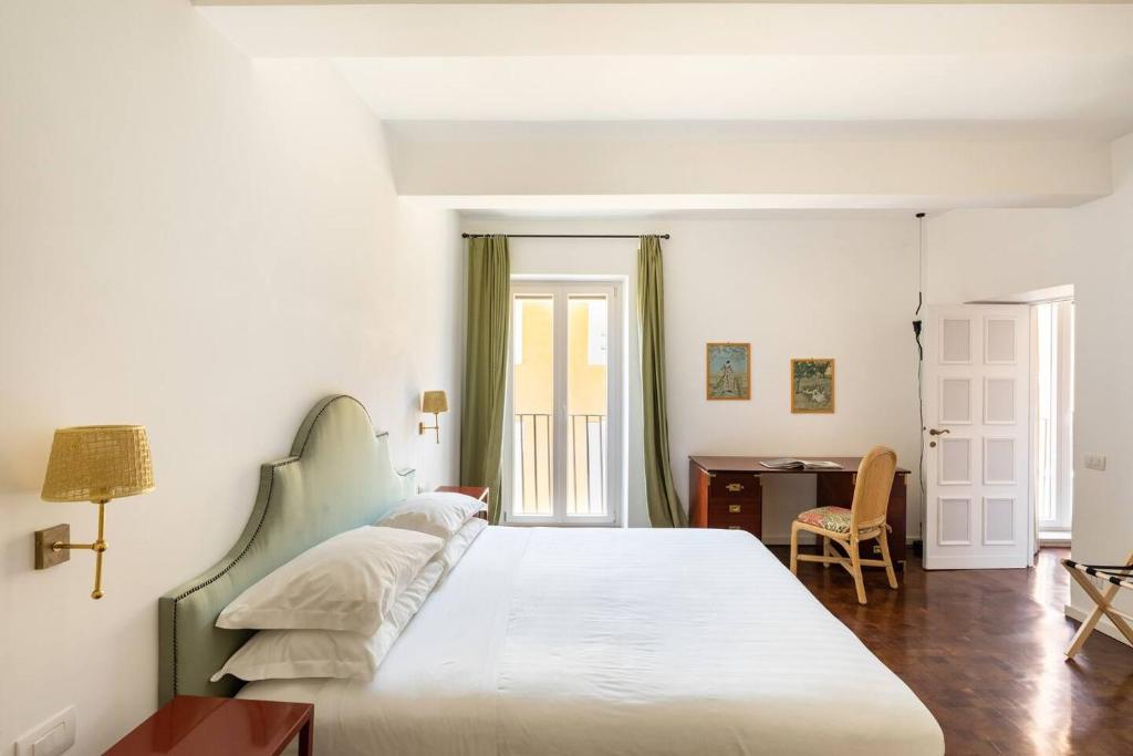 Łóżko lub łóżka w pokoju w obiekcie Residenza Torre Vecchiarelli - apt 4
