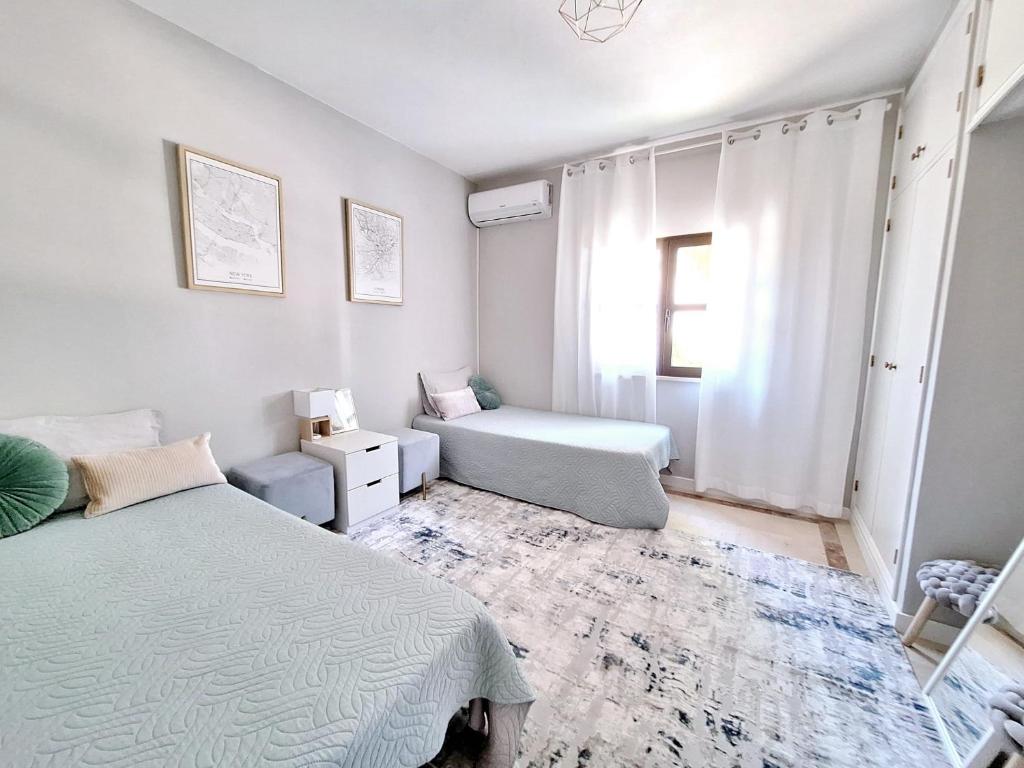 Postel nebo postele na pokoji v ubytování Feliz Algarve