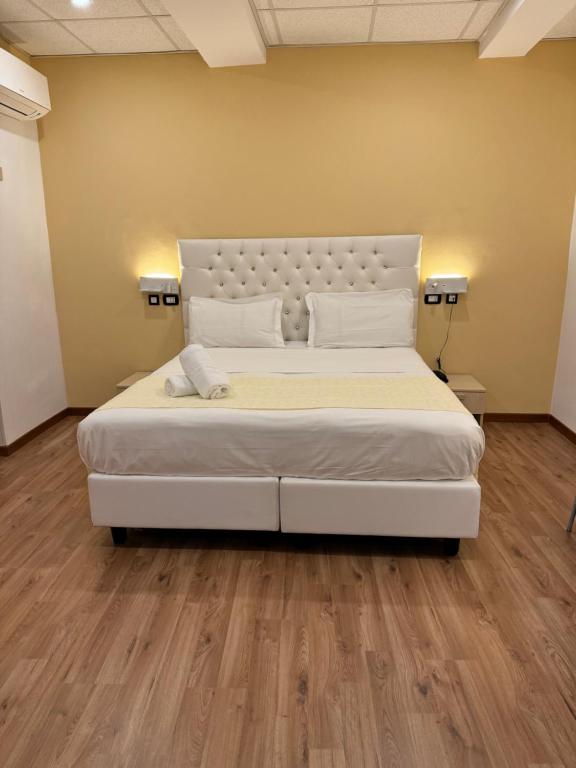 Postel nebo postele na pokoji v ubytování Hotel Veronese