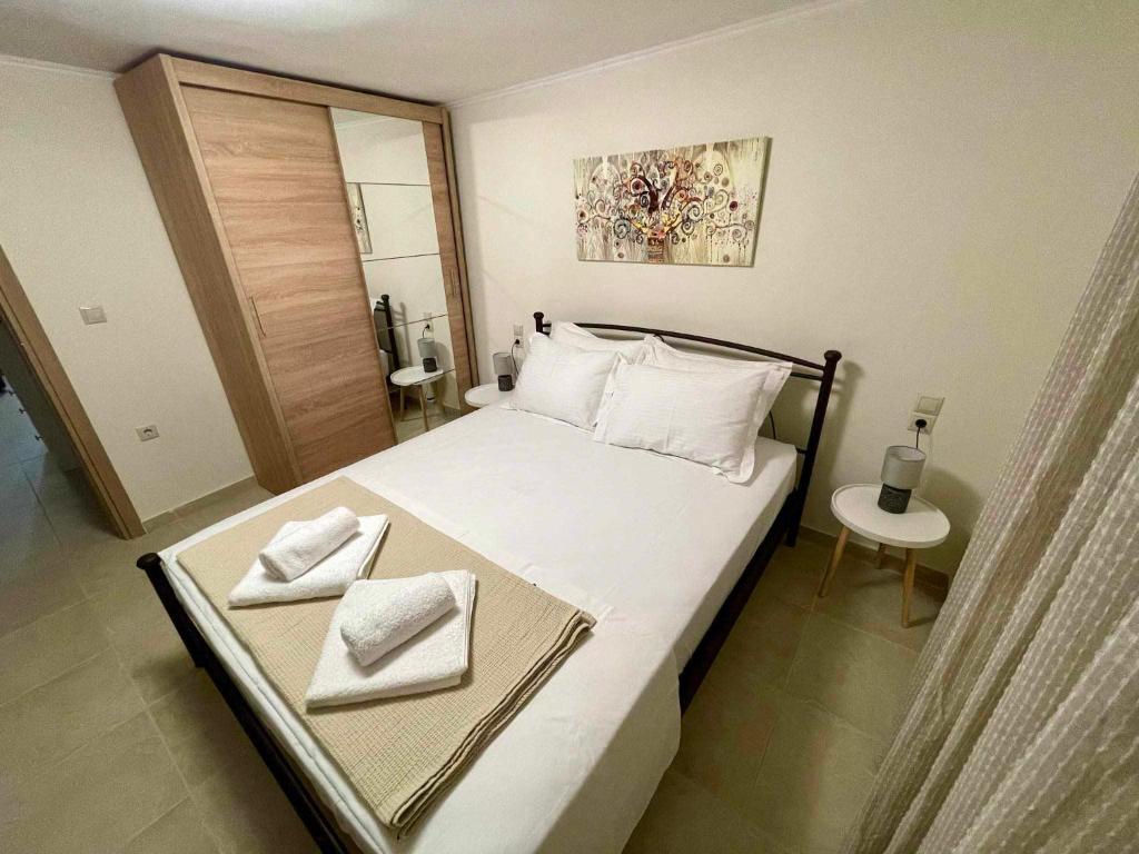 Postel nebo postele na pokoji v ubytování Galini Home