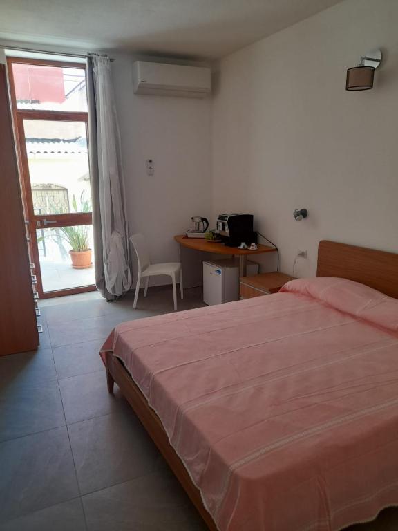 Postel nebo postele na pokoji v ubytování Cristta