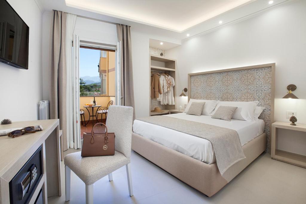 Postel nebo postele na pokoji v ubytování Camalù Sorrento