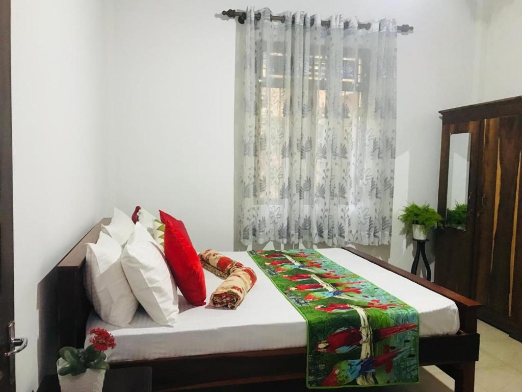 Postel nebo postele na pokoji v ubytování Laaya Kandy