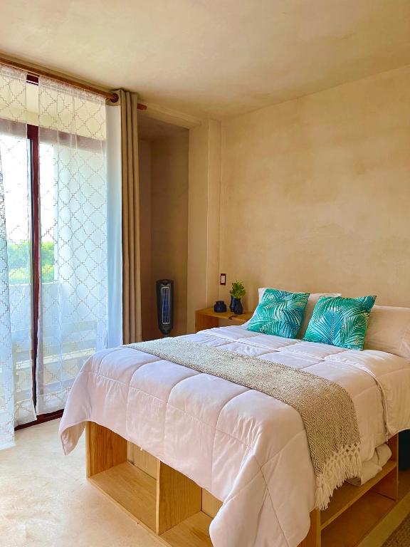 Postel nebo postele na pokoji v ubytování Hotel Casa Maakjä