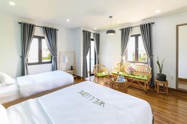 Postel nebo postele na pokoji v ubytování Kivi Homestay Hoi An