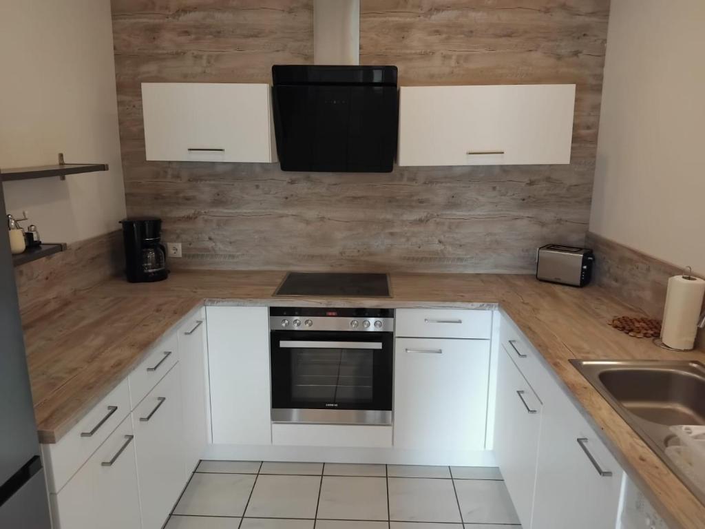Kuchyň nebo kuchyňský kout v ubytování Apartment Fasching