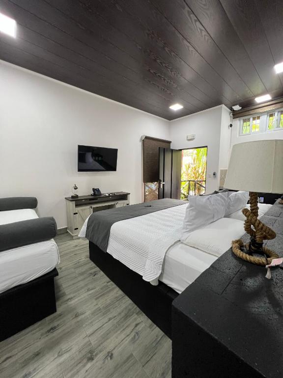 Postel nebo postele na pokoji v ubytování Hotel Boutique Casa Del Rio