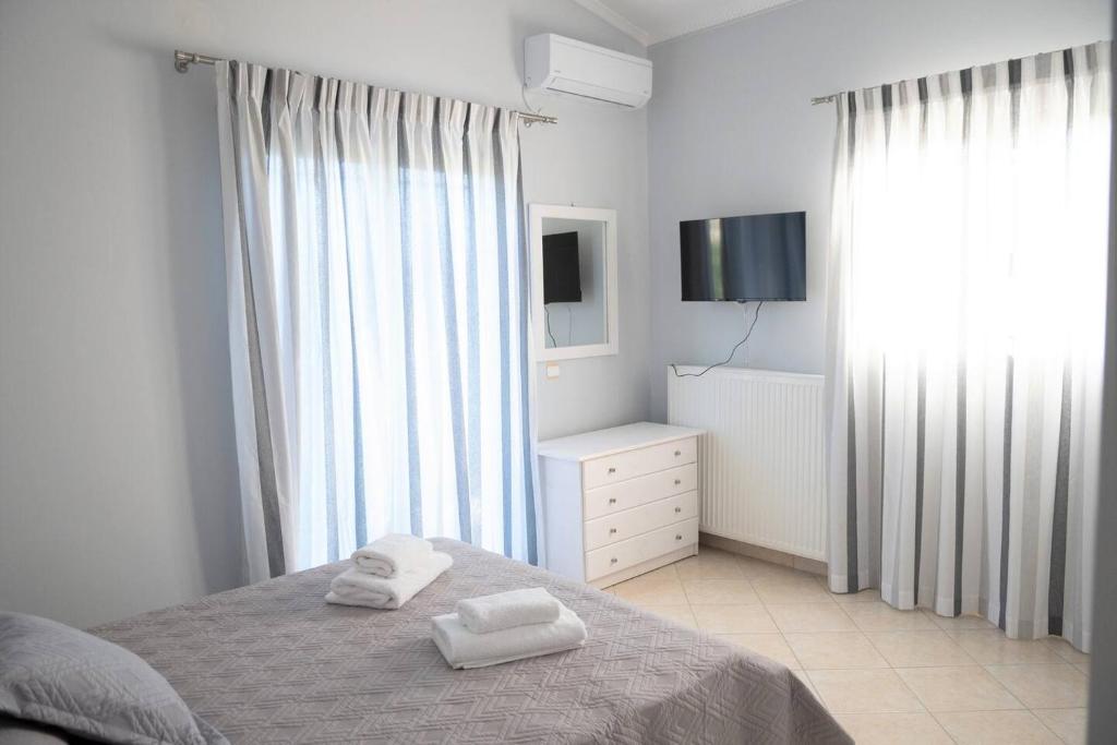 Postel nebo postele na pokoji v ubytování Elenas Villas