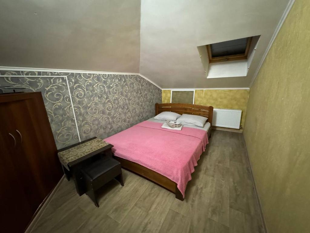 Postel nebo postele na pokoji v ubytování Guest House Na Suvorova