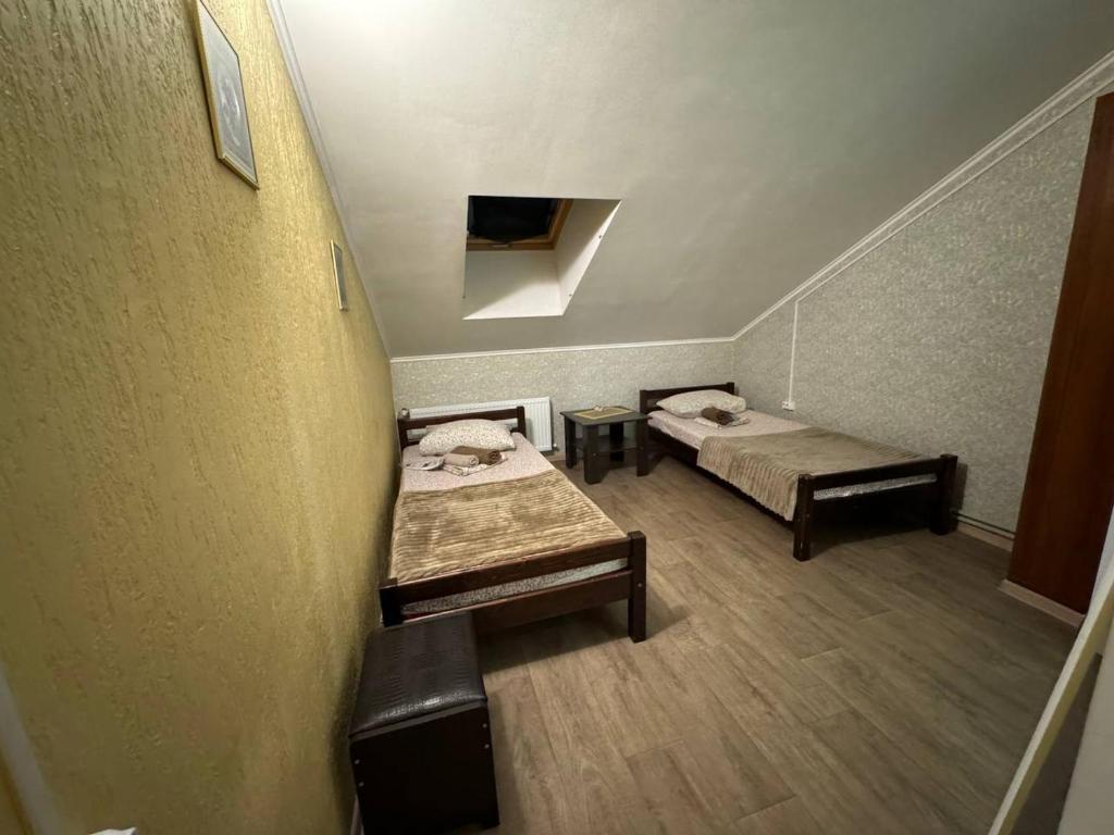 Postel nebo postele na pokoji v ubytování Guest House Na Suvorova