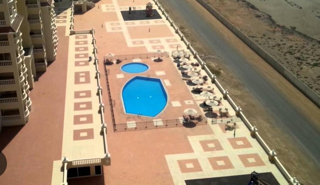 Bazén v ubytování Four Stars Hostel RAS Al-Khaimah nebo v jeho okolí