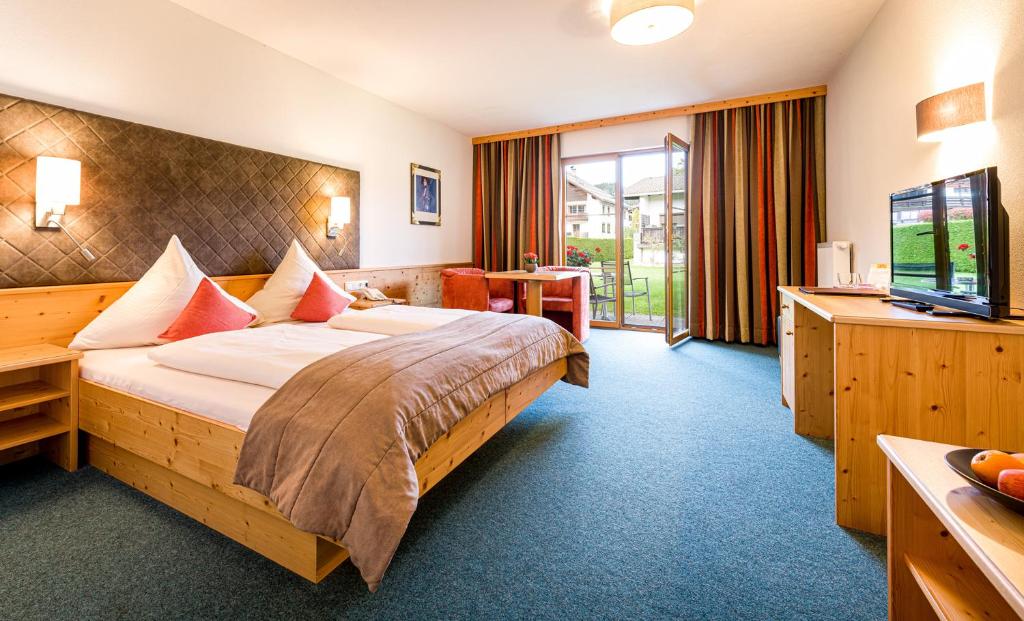 Postel nebo postele na pokoji v ubytování Hotel Goldene Rose
