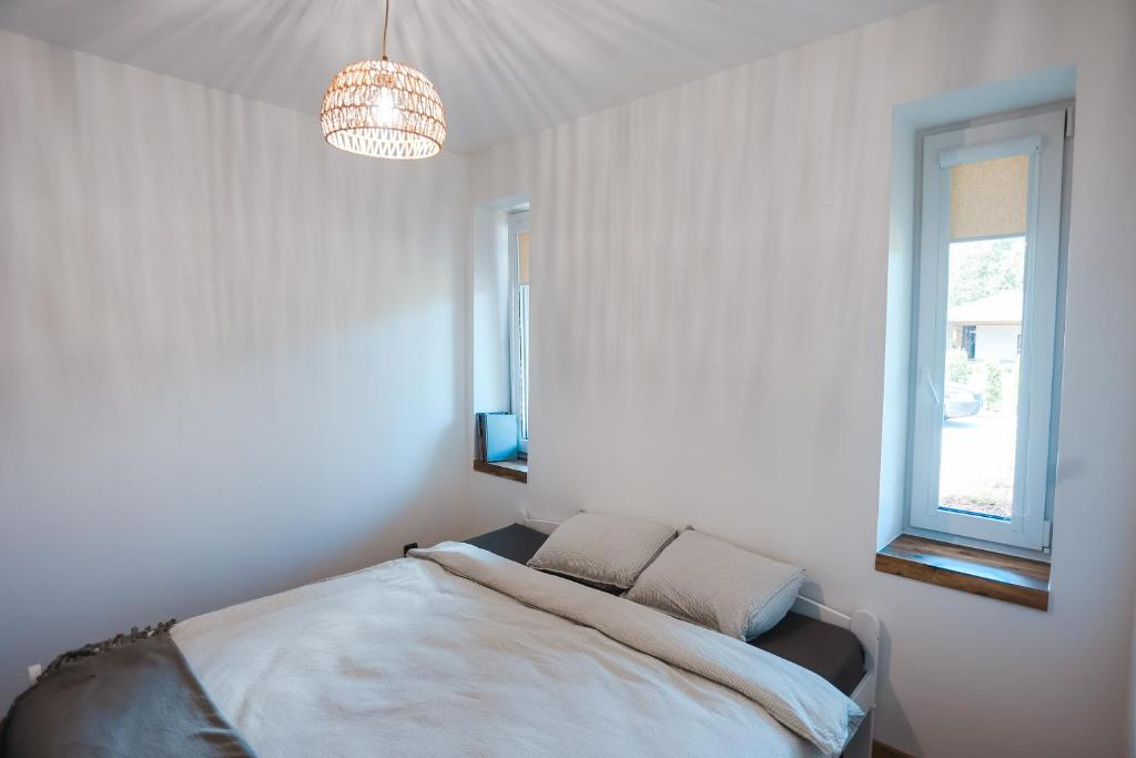 Postel nebo postele na pokoji v ubytování Home Stay Juniper