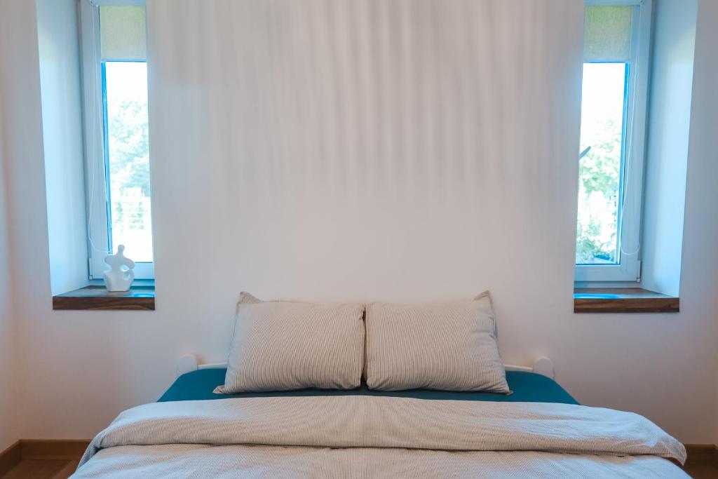 Postel nebo postele na pokoji v ubytování Home Stay Juniper