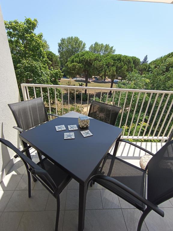 a blue table and chairs on a balcony at Stella di Mare - Cà Savio in Cavallino-Treporti
