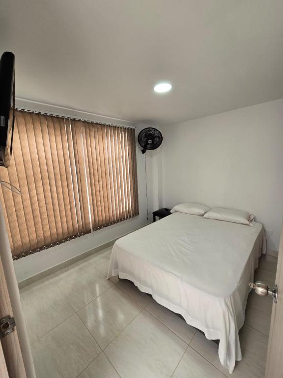 Postel nebo postele na pokoji v ubytování Apartahotel Nueva Imagen