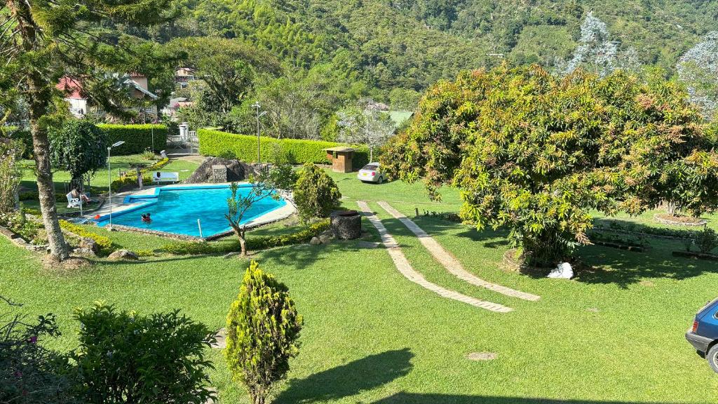 Bazén v ubytování Finca con piscina los Eucaliptos Cali- Pance nebo v jeho okolí