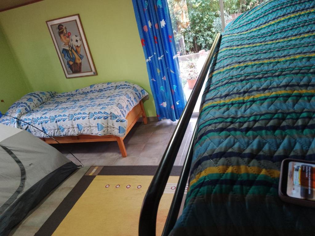 Postel nebo postele na pokoji v ubytování Hospedaje Gratitud Guatavita