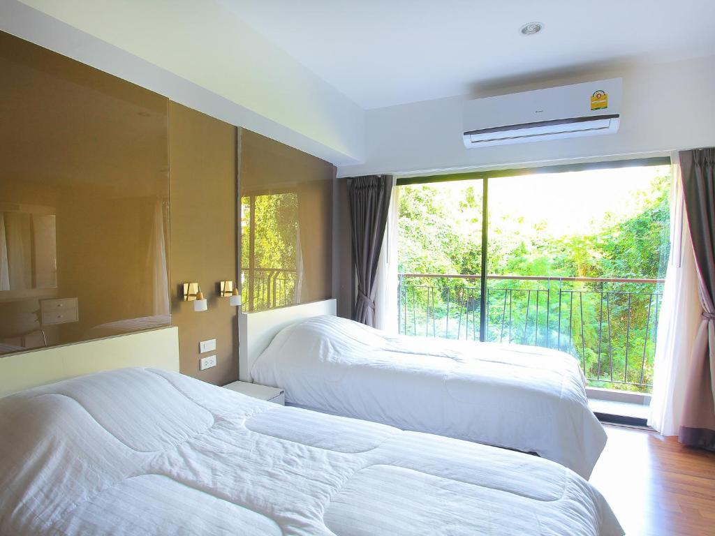 Postel nebo postele na pokoji v ubytování Huahin City View