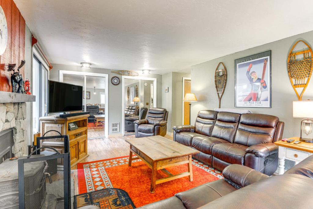 a living room with a couch and a table at West Dover Townhome Hot Tub, 2 Mi to Mount Snow! in West Dover