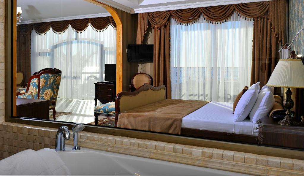 Postel nebo postele na pokoji v ubytování Villa Augusto Boutique Hotel & SPA