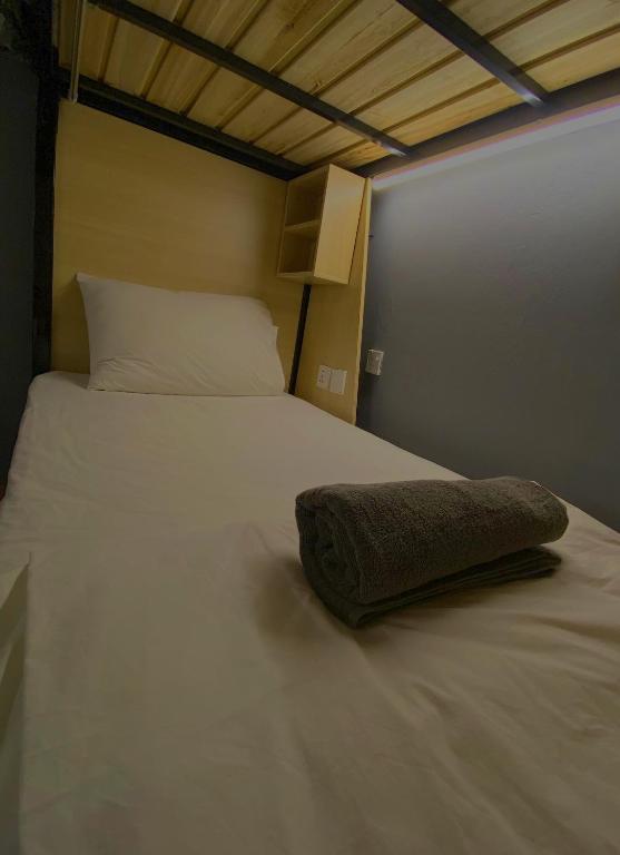 Postel nebo postele na pokoji v ubytování Travelogue Guest House