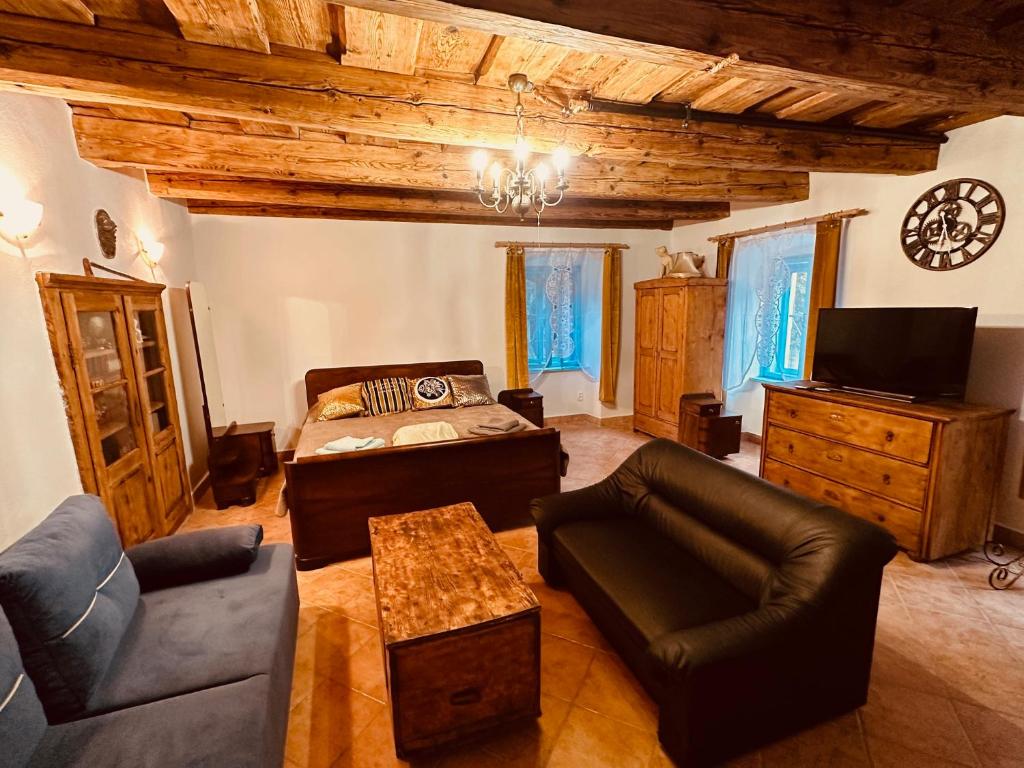 a living room with a couch and a table at Zázrak in Banská Štiavnica