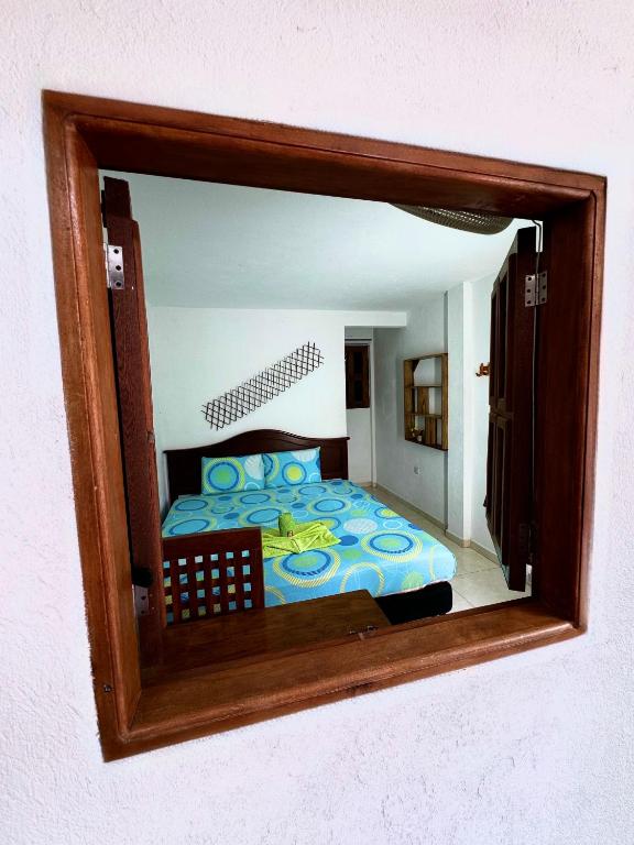 Postel nebo postele na pokoji v ubytování Hostal Nibuni Palomino