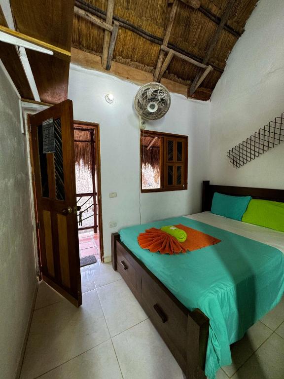 Postel nebo postele na pokoji v ubytování Hostal Nibuni Palomino