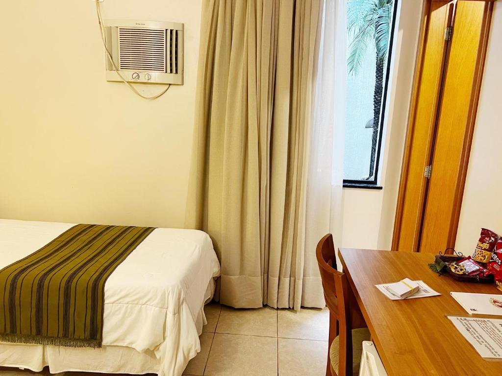 Postel nebo postele na pokoji v ubytování Hotel Dom Leopoldo
