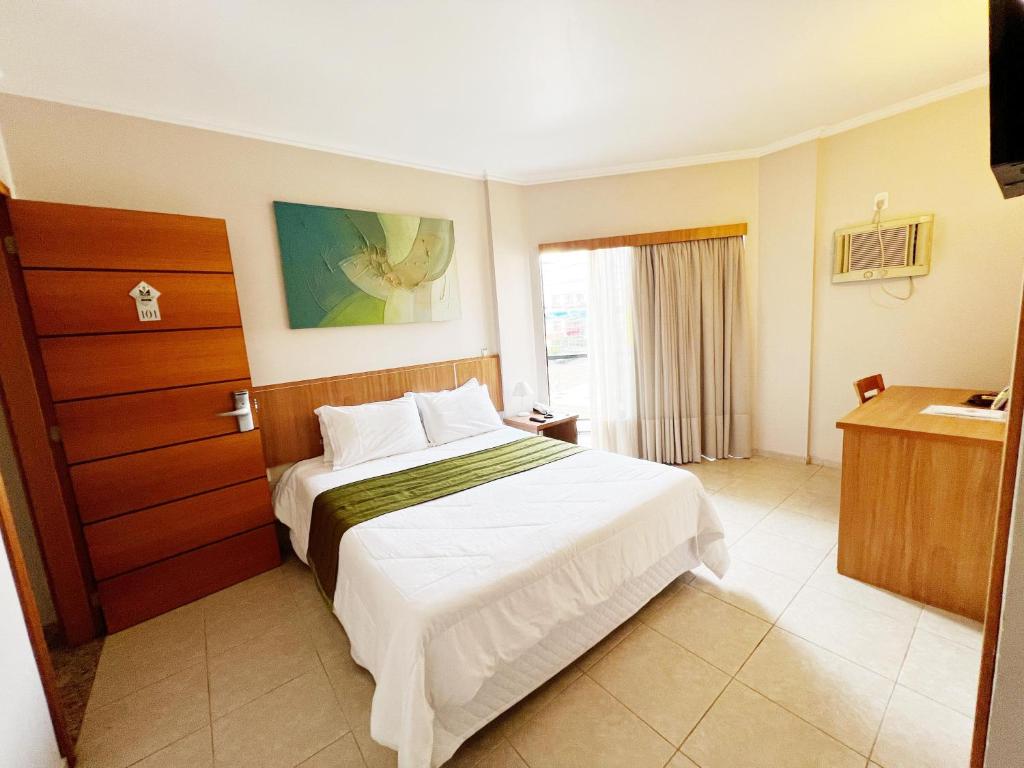 Postel nebo postele na pokoji v ubytování Hotel Dom Leopoldo
