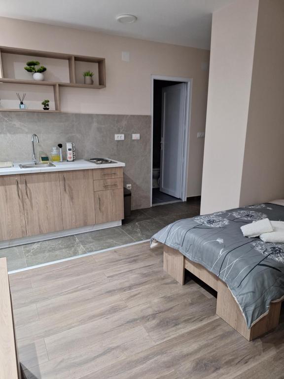 Postel nebo postele na pokoji v ubytování Apartments Green Beograd