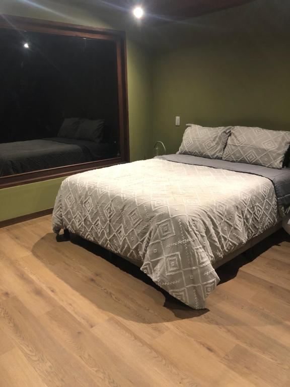 Postel nebo postele na pokoji v ubytování Glamping La Reserva