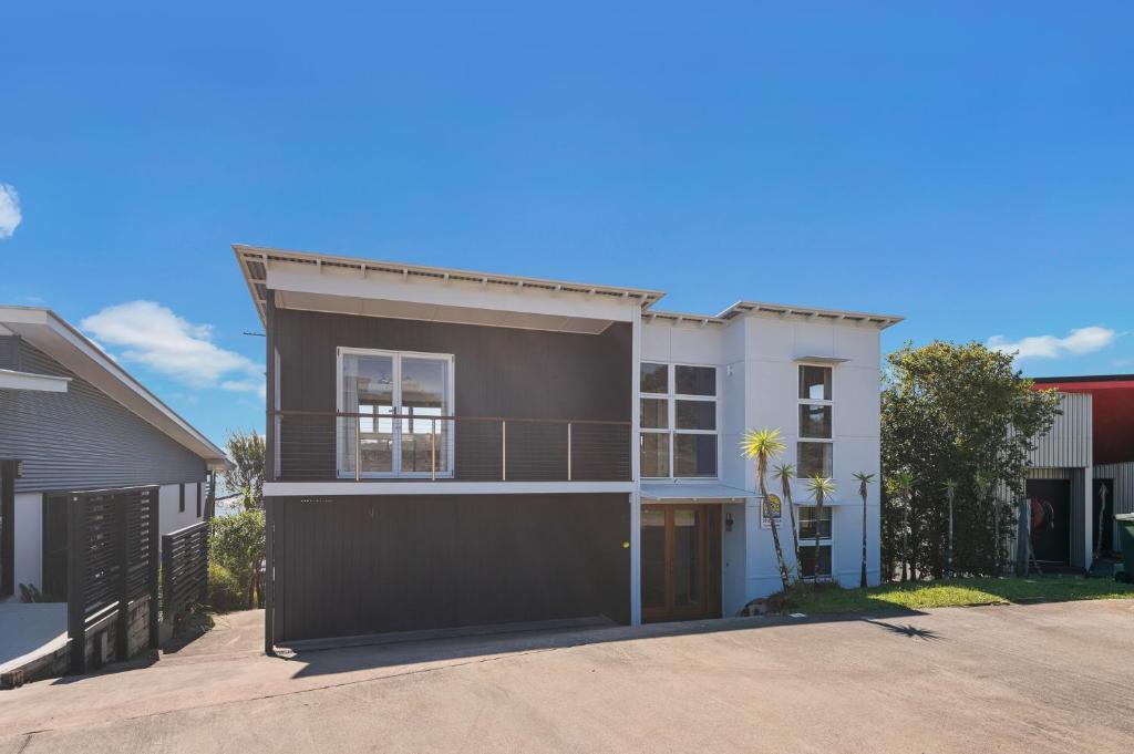 a house with a balcony and a garage at DOLCE VILLA in Tangalooma