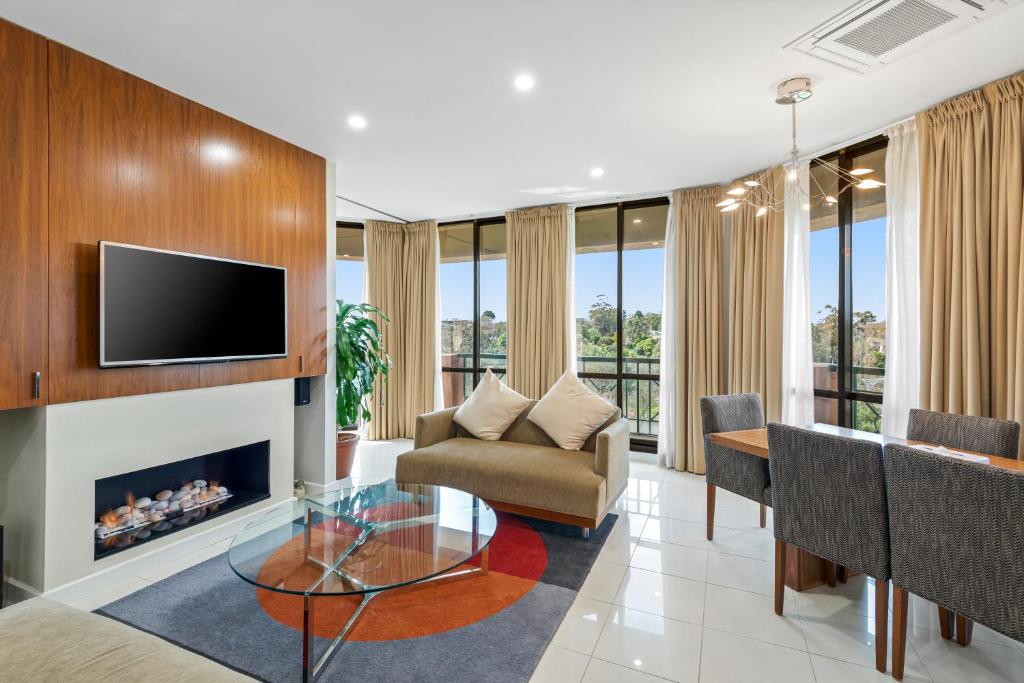 TV a/nebo společenská místnost v ubytování Amora Hotel Riverwalk Melbourne