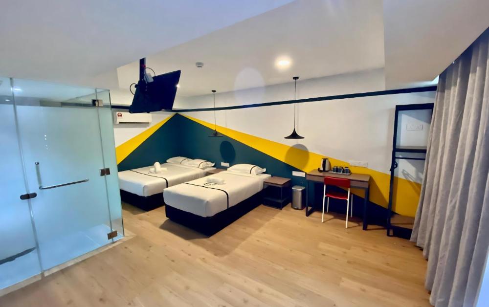 Postel nebo postele na pokoji v ubytování Seeds Hotel Selayang