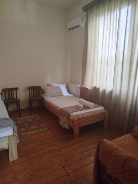 Postel nebo postele na pokoji v ubytování Gremeli Wine & Hotel