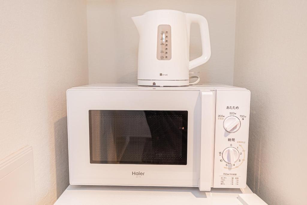 New Cozy APT Located on the Japanese Local shopping streetにあるキッチンまたは簡易キッチン