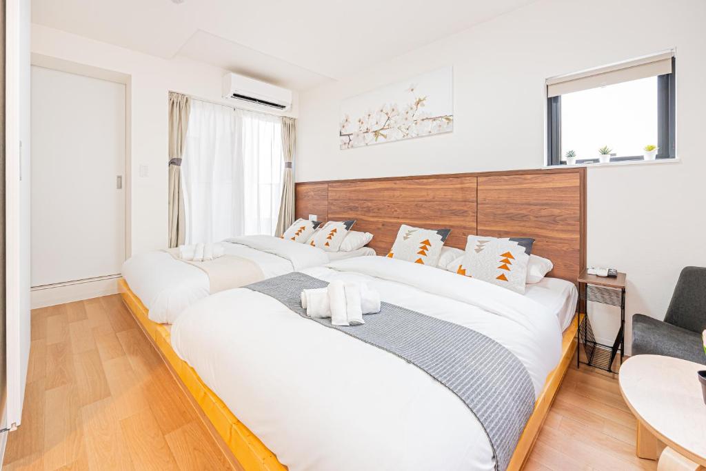 New Cozy APT Located on the Japanese Local shopping streetにあるベッド