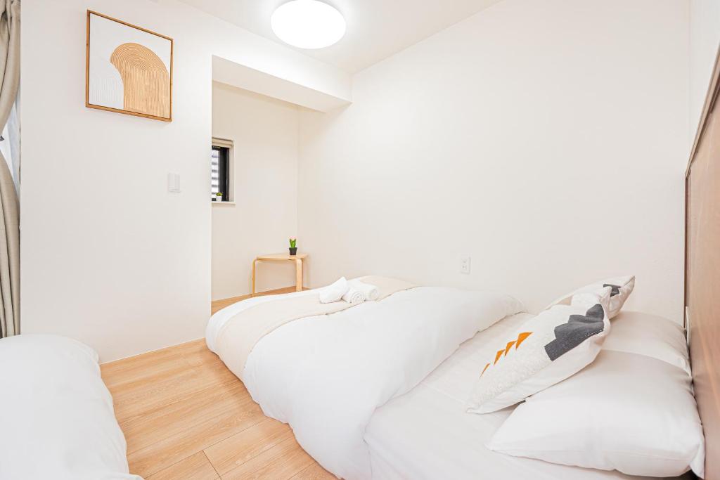 New Cozy APT Located on the Japanese Local shopping streetにあるベッド
