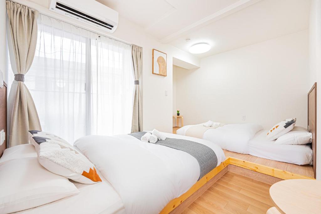 New Cozy APT Located on the Japanese Local shopping streetにあるベッド