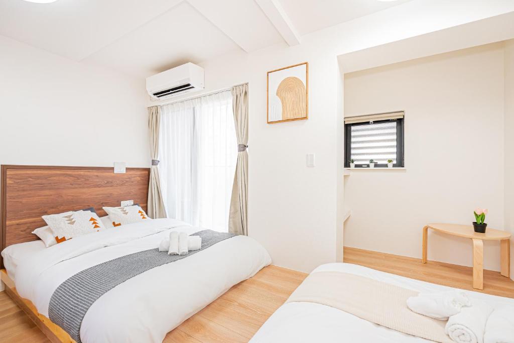 New Cozy APT Located on the Japanese Local shopping streetにあるベッド