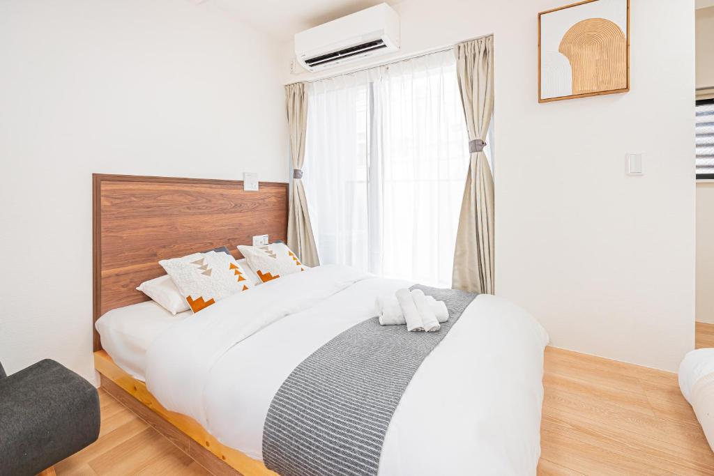 New Cozy APT Located on the Japanese Local shopping streetにあるベッド