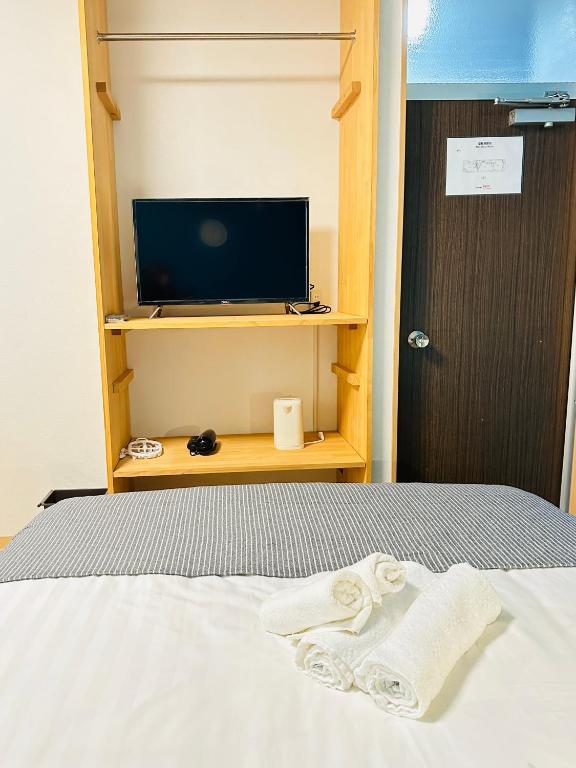 Postel nebo postele na pokoji v ubytování home鶴見橋