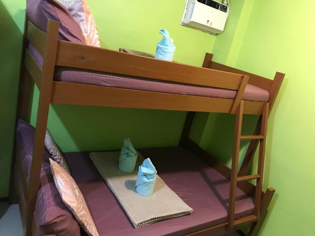 Postel nebo postele na pokoji v ubytování Elmo’s place