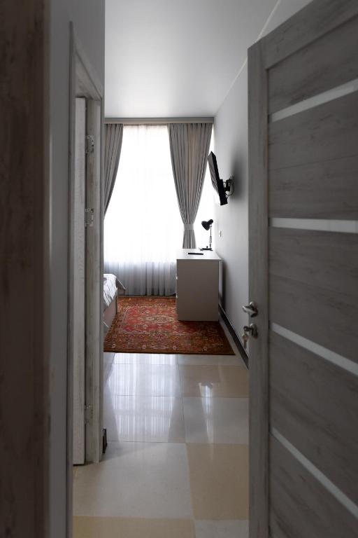 Postel nebo postele na pokoji v ubytování Gladzor Hotel