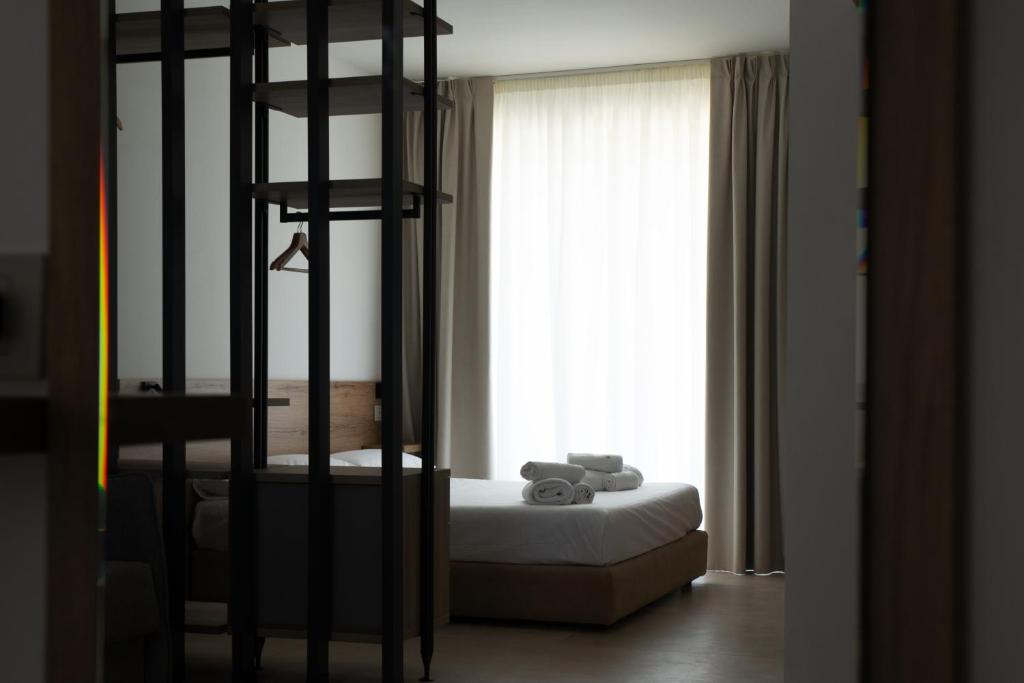 Postel nebo postele na pokoji v ubytování Montedarena Hotel