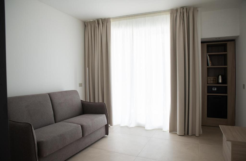 Posezení v ubytování Montedarena Hotel